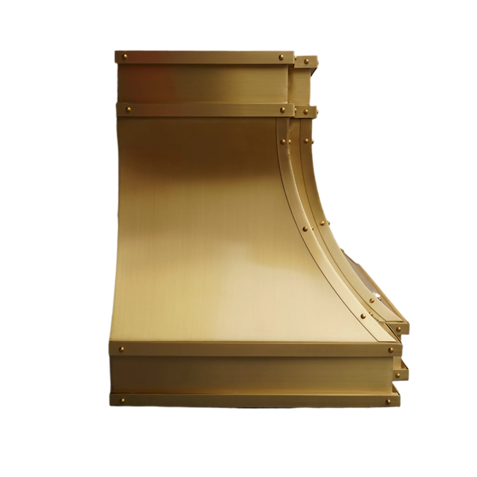 Custom brass range hood with chimney installed in modern kitchen
