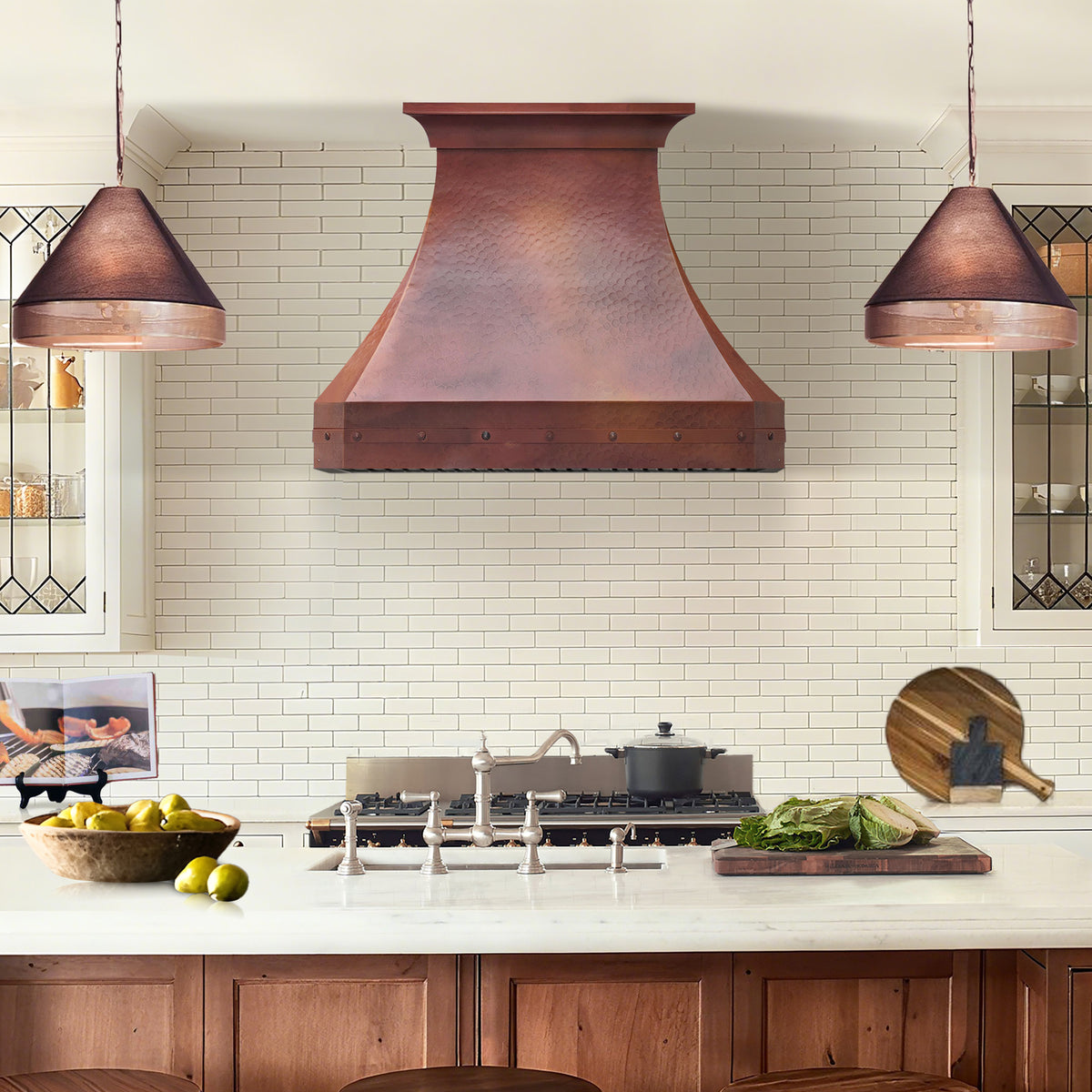 CKH fired copper range hood with hand-hammered texture, elegant curved silhouette, and rich copper finish.