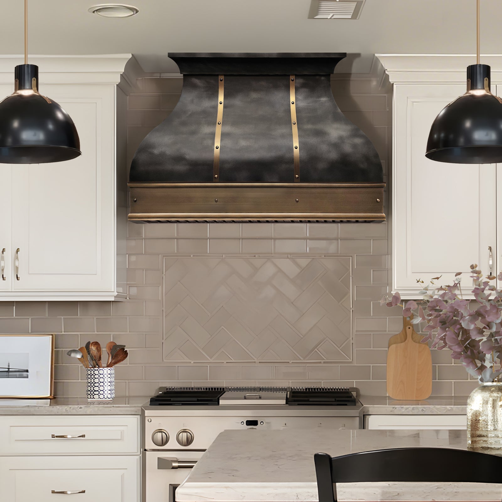 Modern kitchen with a large range hood, tiled backsplash, and decorative elements.