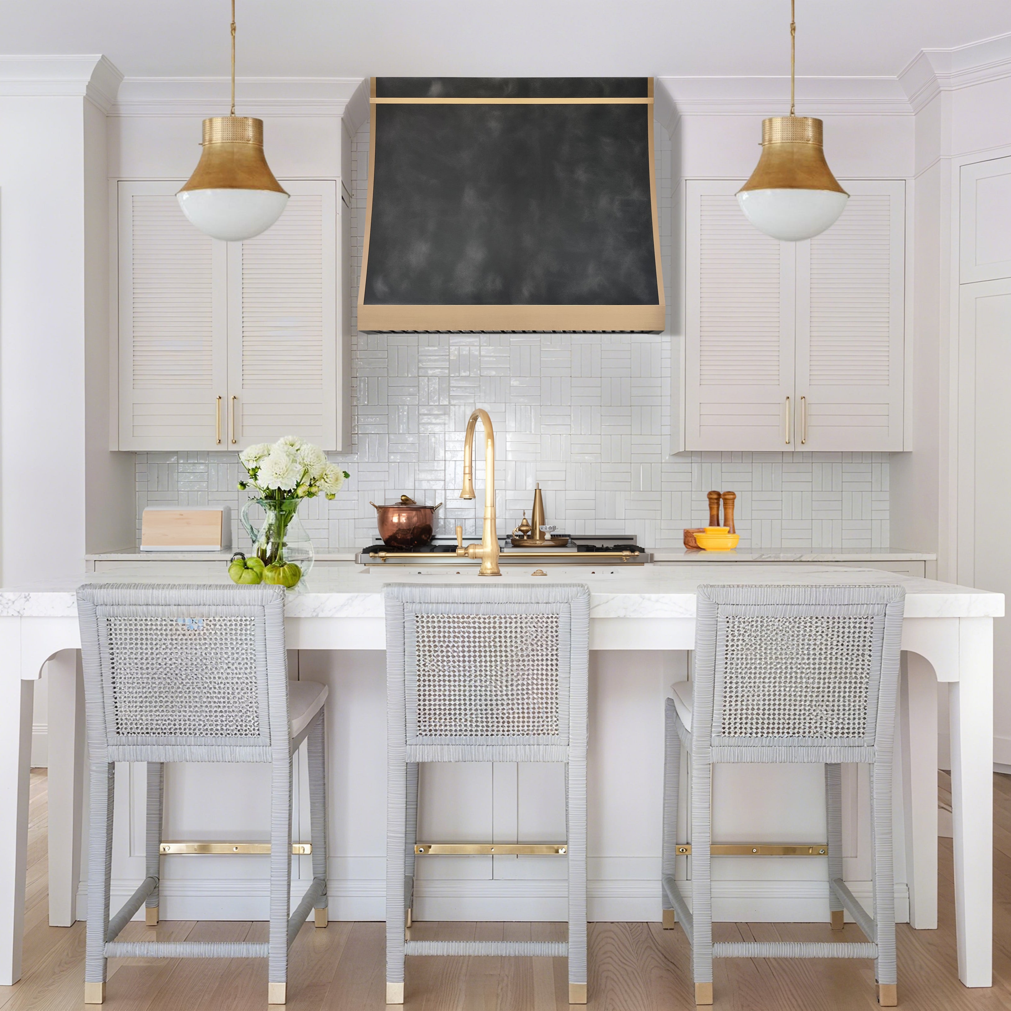 CKH modern zinc range hood featuring sleek brass accent trim, a textured dark finish, and refined contemporary design.