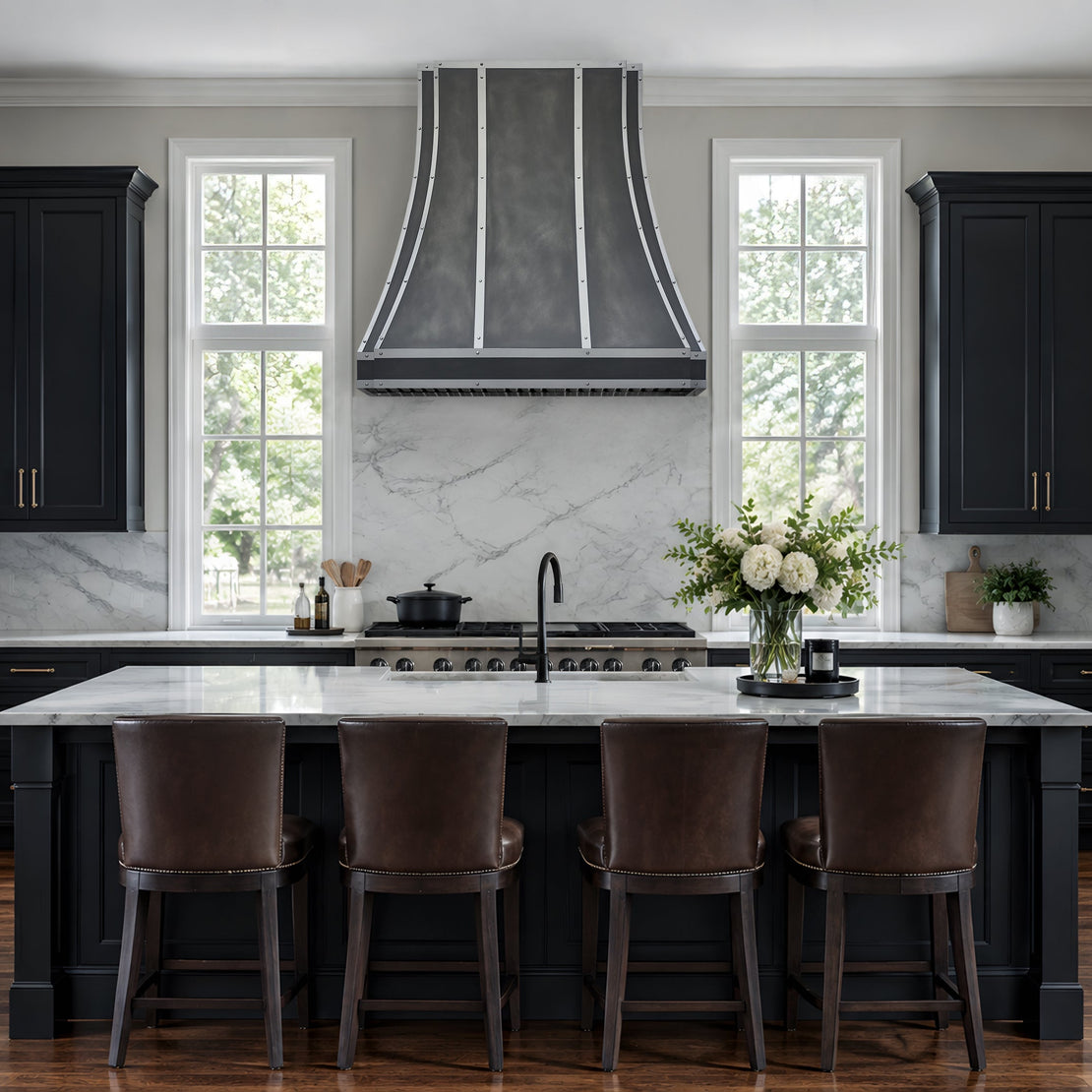 zinc range hood in a luxury kitchen interior featuring dark charcoal/black cabinets