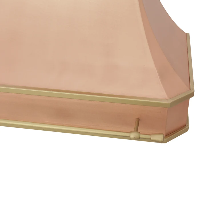 close-up of a CKH copper range hood with a brass trim