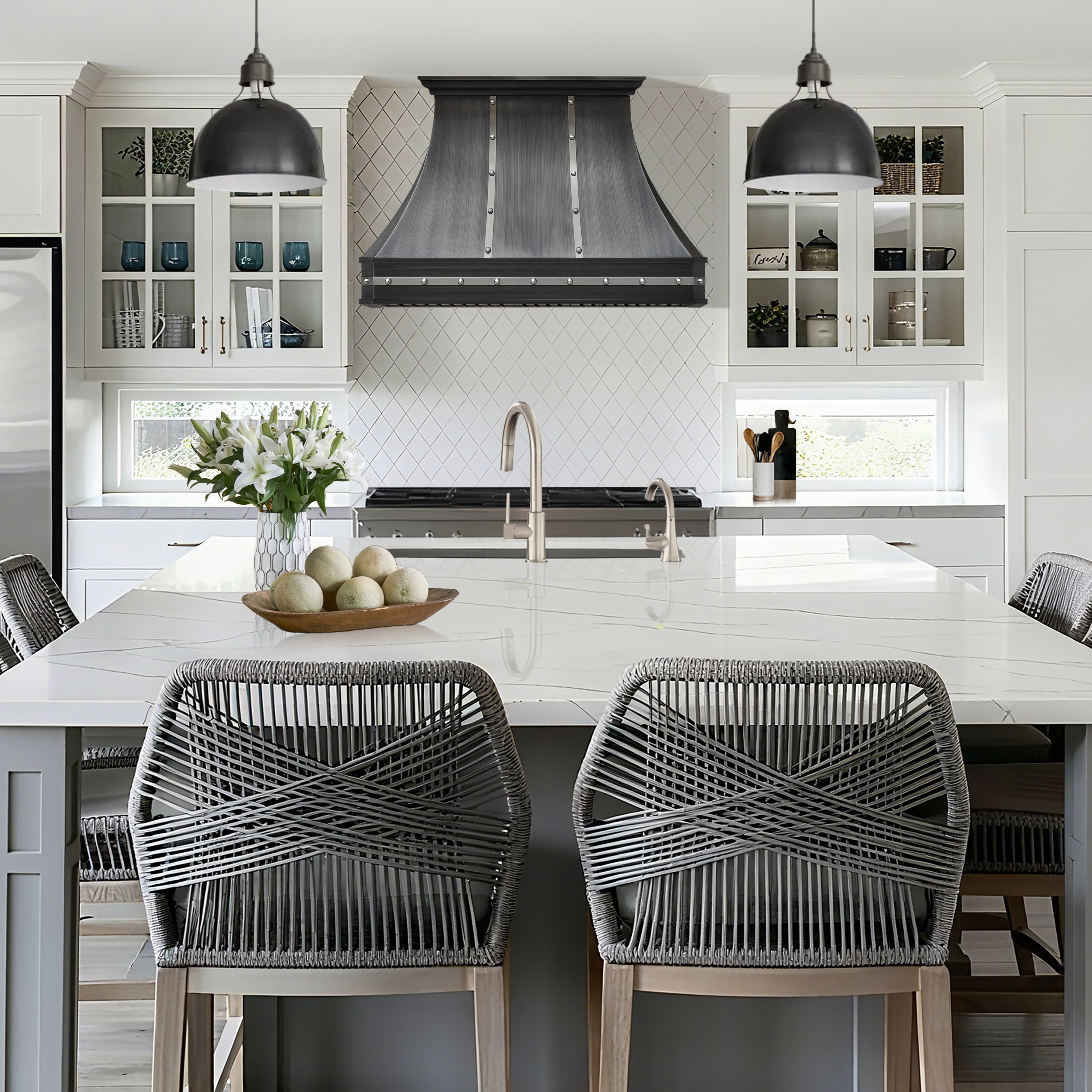 CKH zinc kitchen hood (Z12) featuring a brushed finish, rivet detailing, and an industrial-inspired curved silhouette for bold kitchen style.