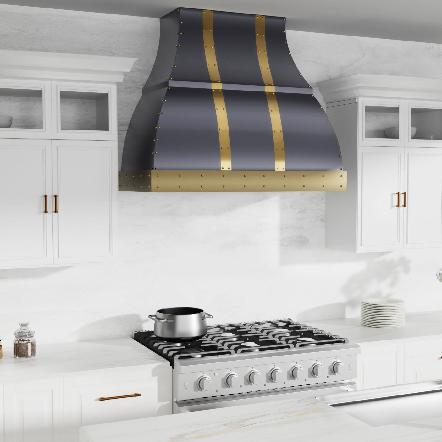Modern kitchen with a large black and gold range hood above a stove.