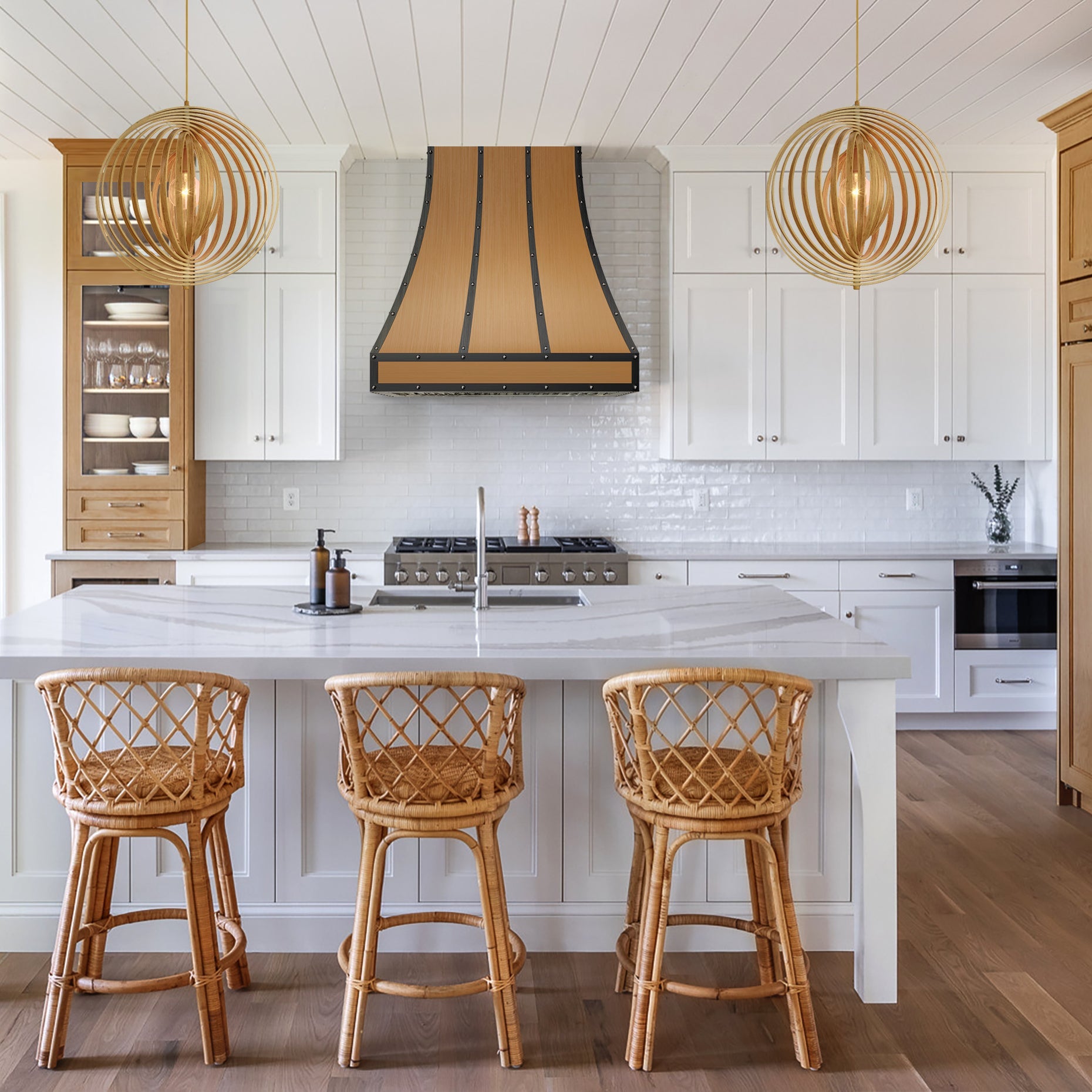 Black - metal - trimmed brass range hood with wood - tone finish, fitting kitchens that pair wooden cabinetry