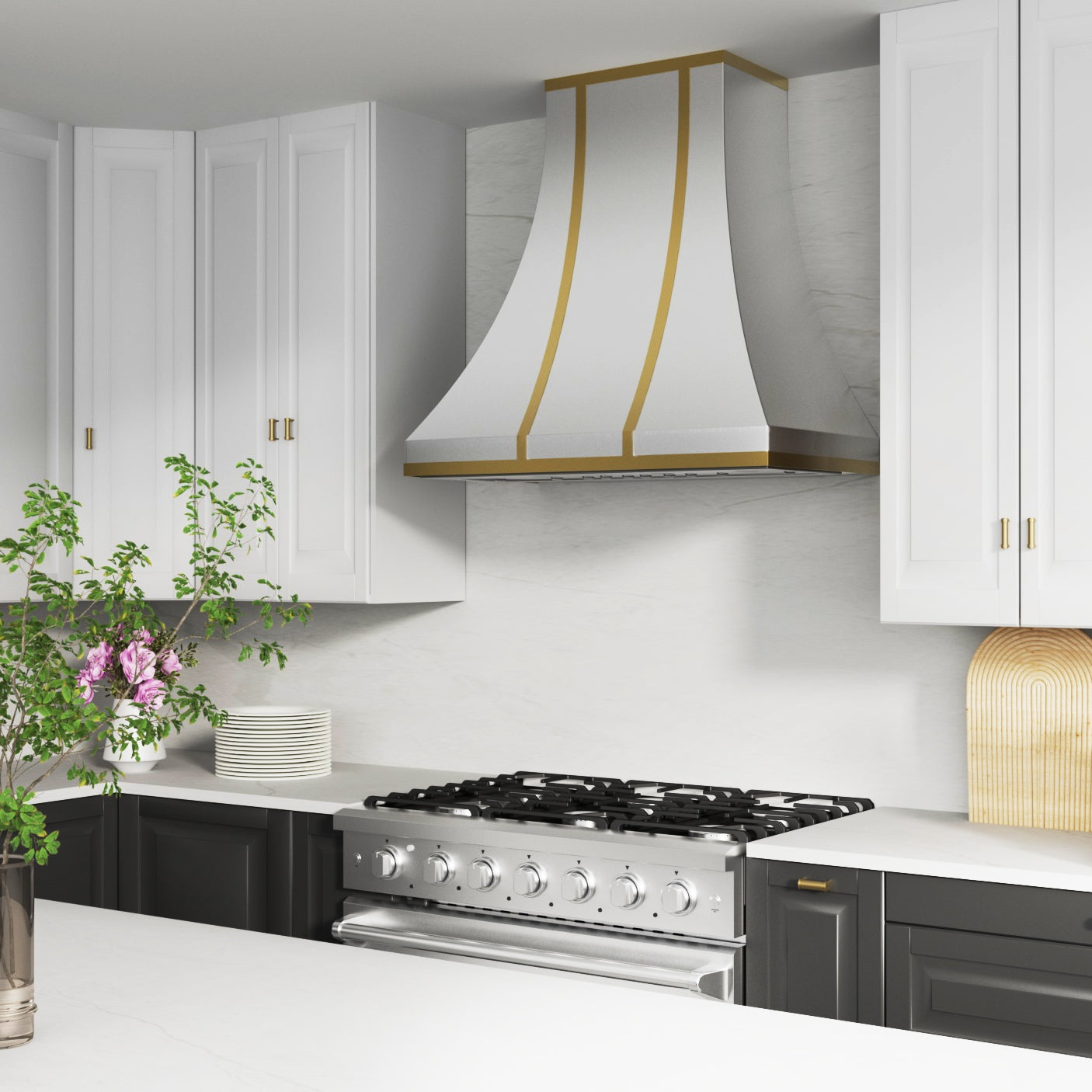 Modern kitchen with white cabinets, a stainless steel stove, and decorative hood.